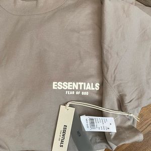 Fear of God tee shirt. Never been worn. Also comes with Essentials bag.